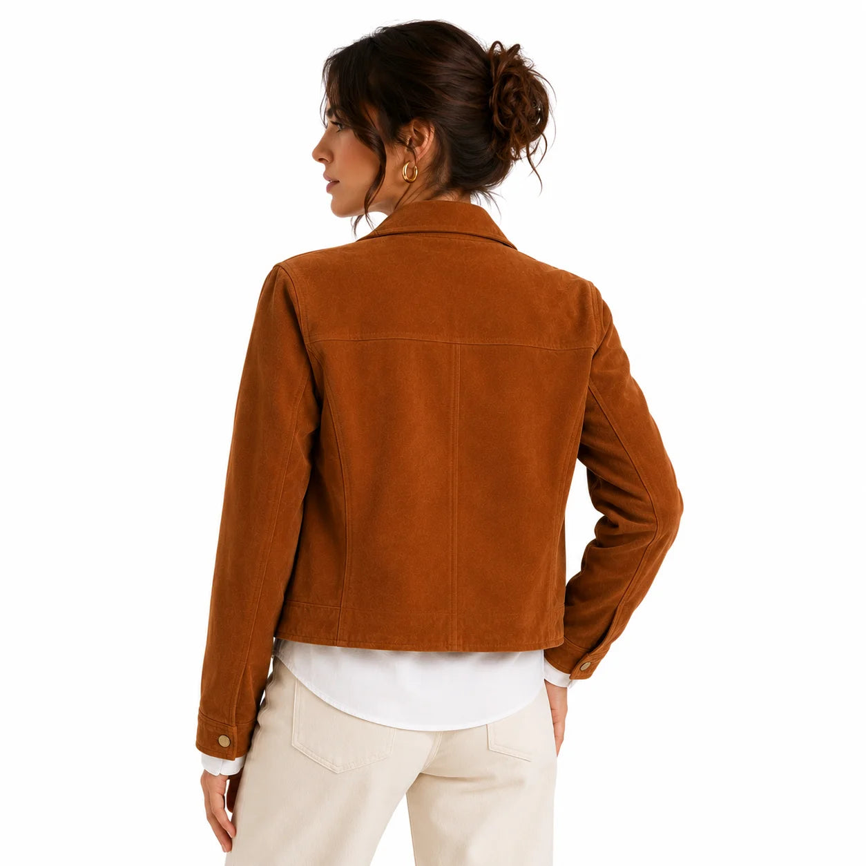 Back view of woman wearing caramel suede structured leather jacket with white shirt and cream trousers