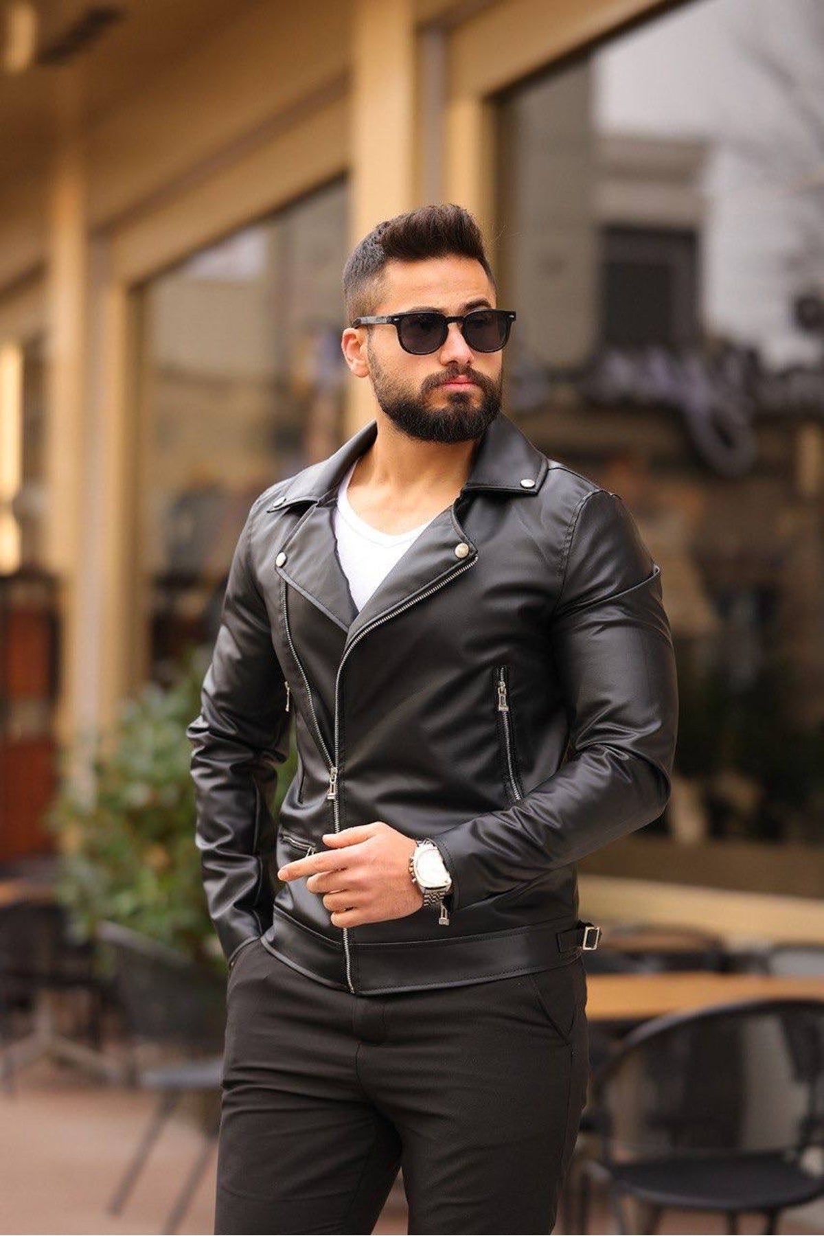 Black leather biker jacket open showing black interior lining and inside pocket