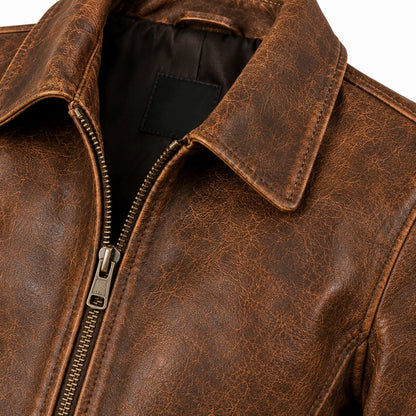 Close-up of light natural distressing and vegetable-tan cowhide grain, women's vintage jacket