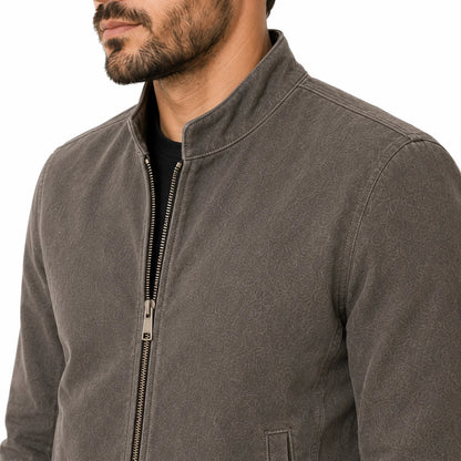 Close-up of suede cafe racer short stand-up collar and minimal welt pocket