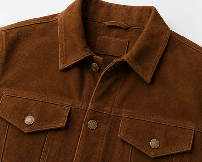 Close-up of suede trucker jacket chest pocket and button flap detail