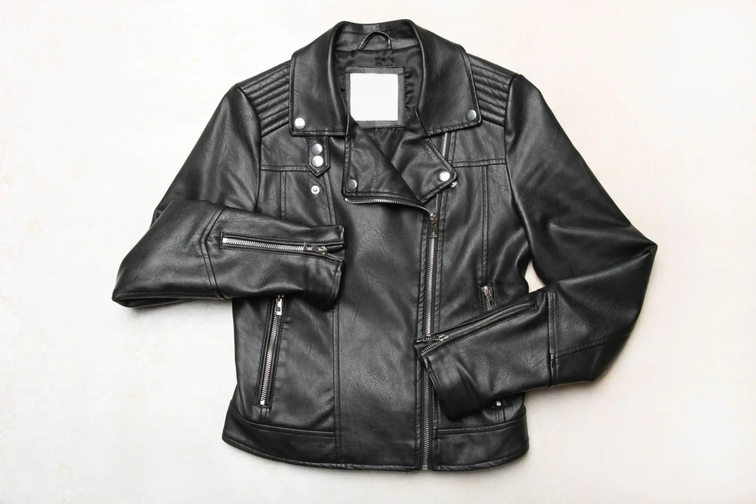 Custom men's leather jacket with embroidered patches and brass hardware — bespoke cowhide build