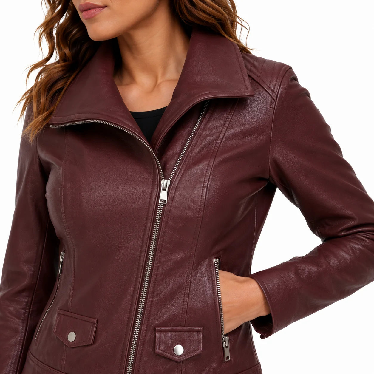 Close-up of wine red lambskin leather grain with asymmetrical zipper hardware and flap pocket stitching