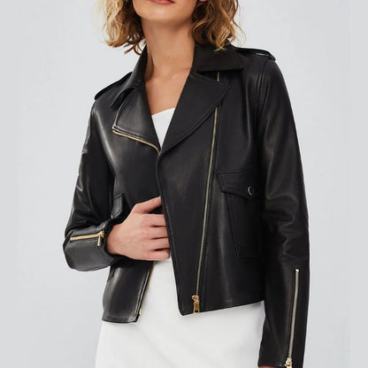 Women's black asymmetrical biker leather jacket in genuine lambskin, front view showing the off-center gold-tone zip and wide notched lapel