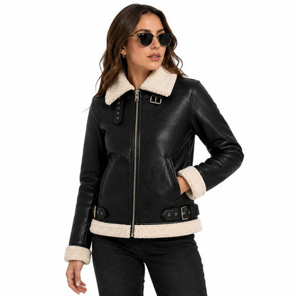 Close-up of women's black shearling aviator leather jacket showing premium leather and cream faux fur collar
