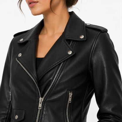 Close-up of a women's black celebrity inspired leather biker jacket showing premium leather texture, lapels, and silver zipper details.