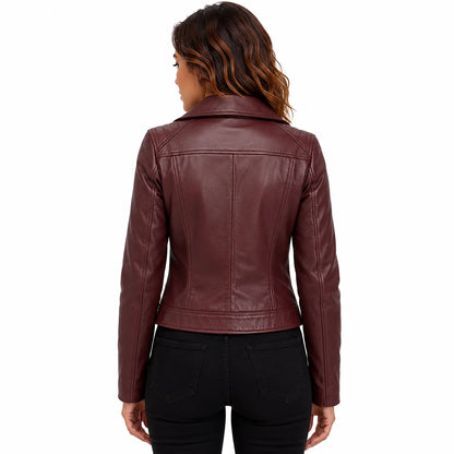 Back view of woman wearing wine red lambskin moto jacket, tailored fit with black jeans